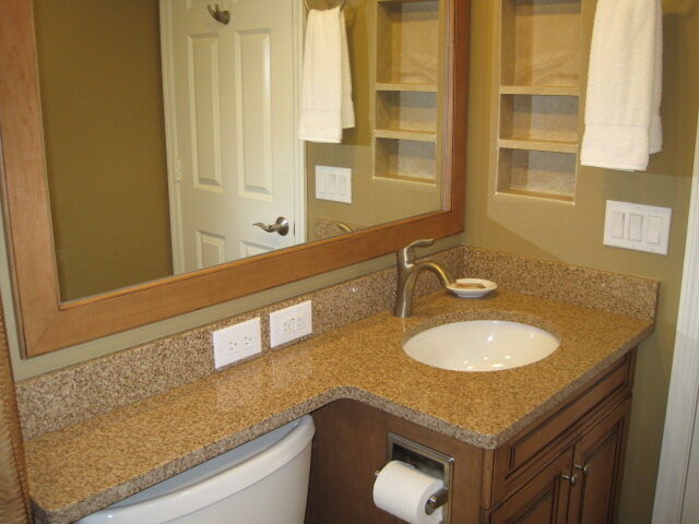 Stylish granite vanity with large mirror and smart built-in storage