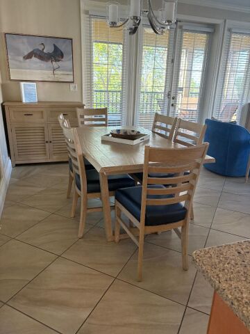 Bright dining area for 6 with natural light and relaxing coastal charm