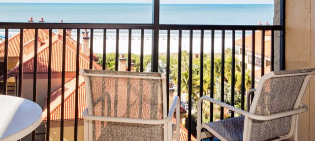 Private balcony with seating and peaceful coastal view