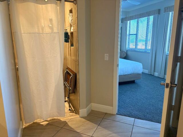 Bright bedroom with easy bath access and natural light