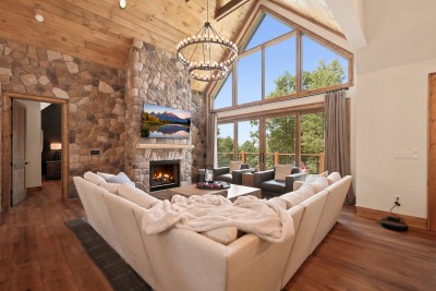 Curl up by the stone fireplace with the TV tuned to a crackling mountain scene of its own, cozy, vaulted, and built for slow evenings.