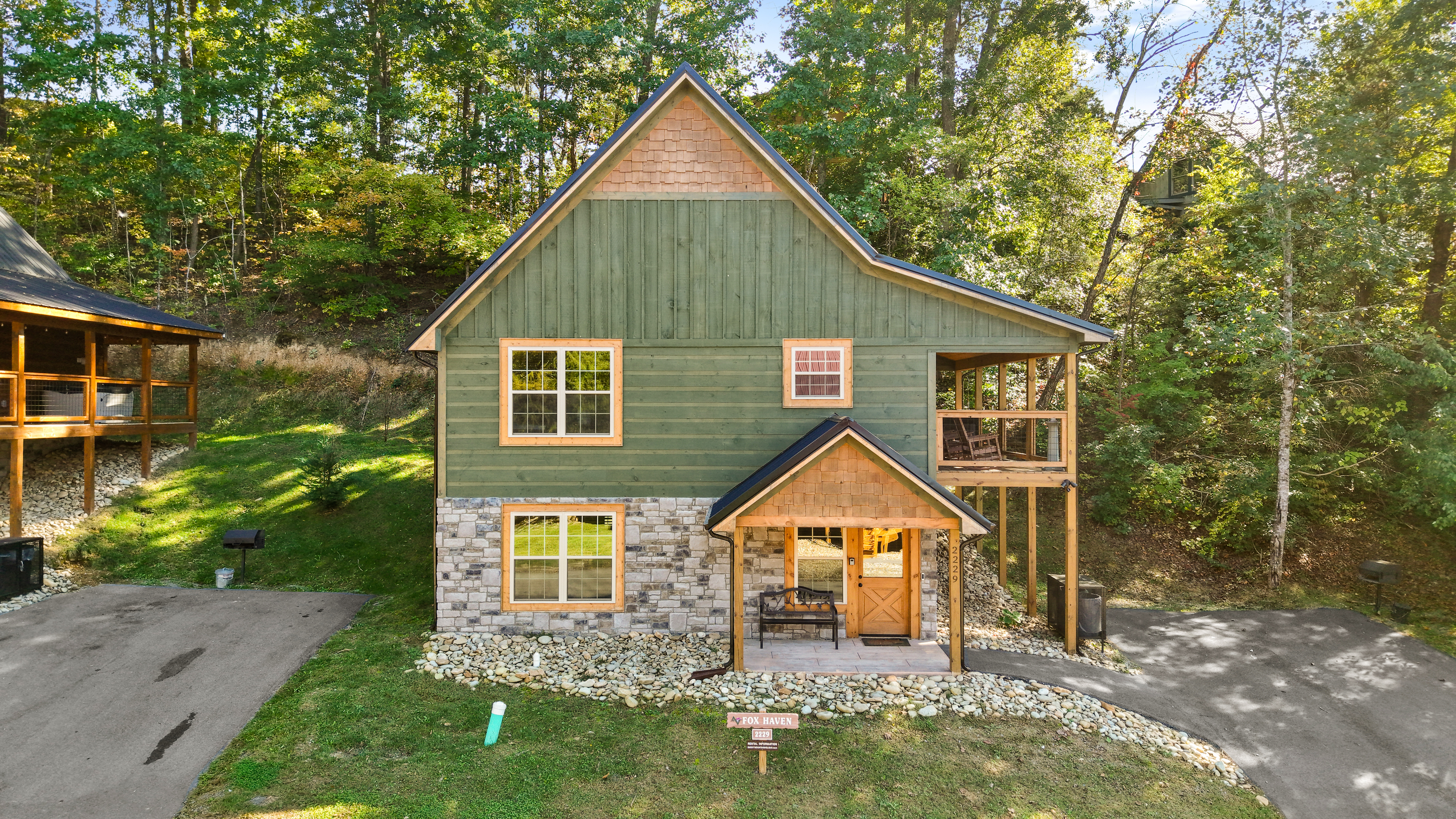 Charming wooded cabin with screened deck and covered front porch