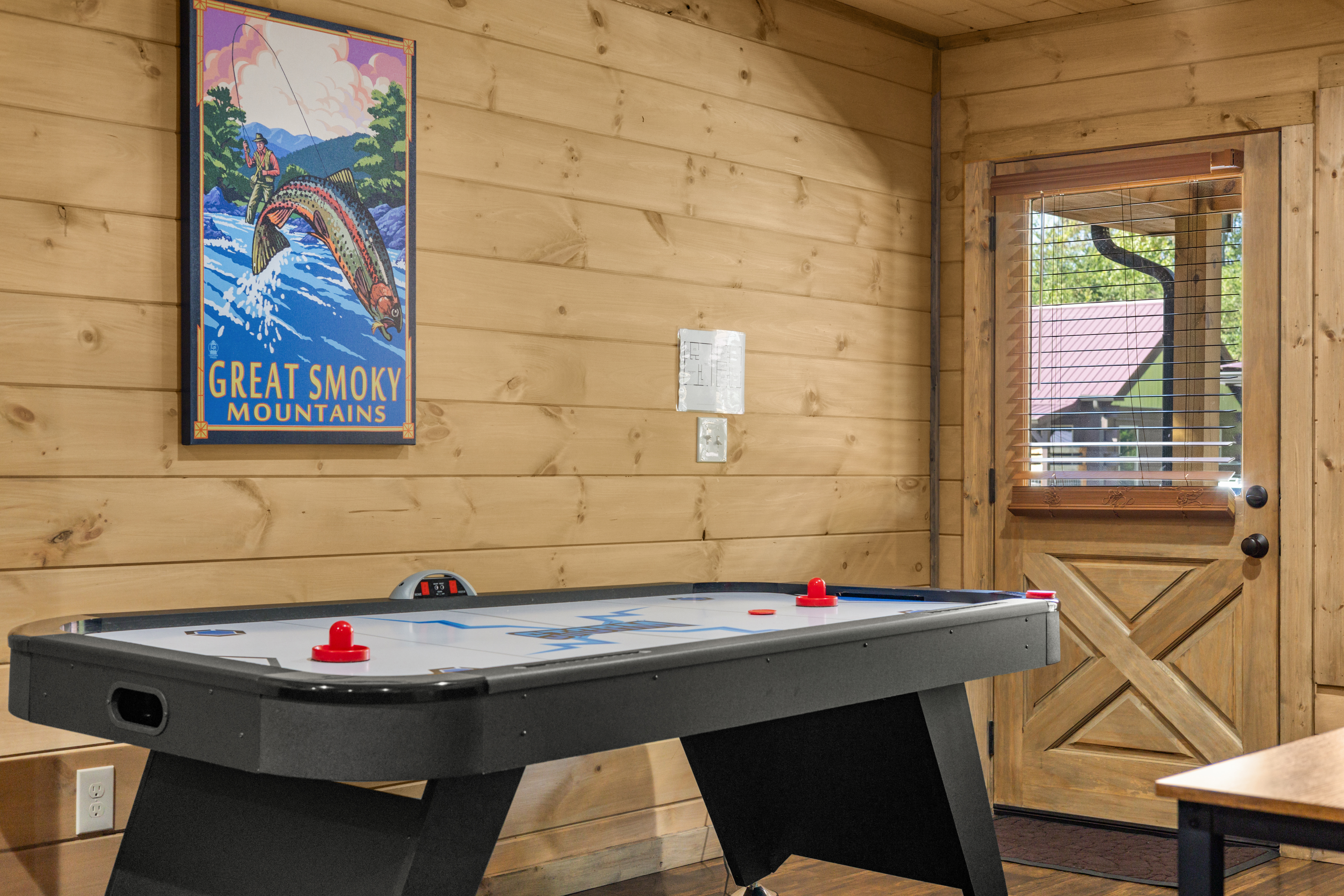 Rustic game room with air hockey for fun cabin nights