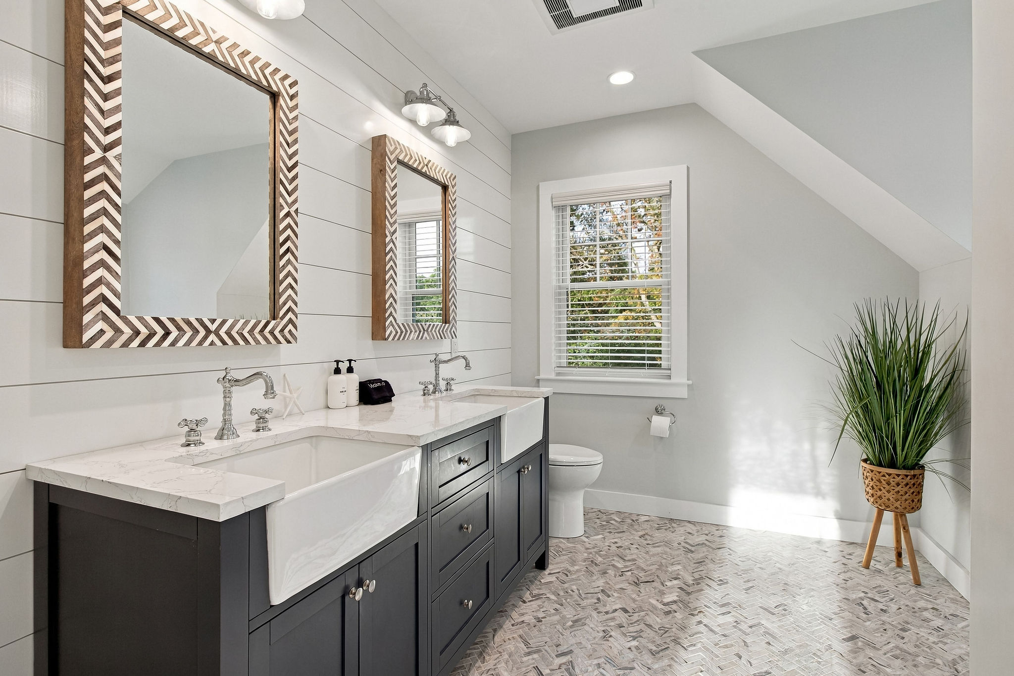 Bright spa-like bathroom with double vanity and stylish finishes