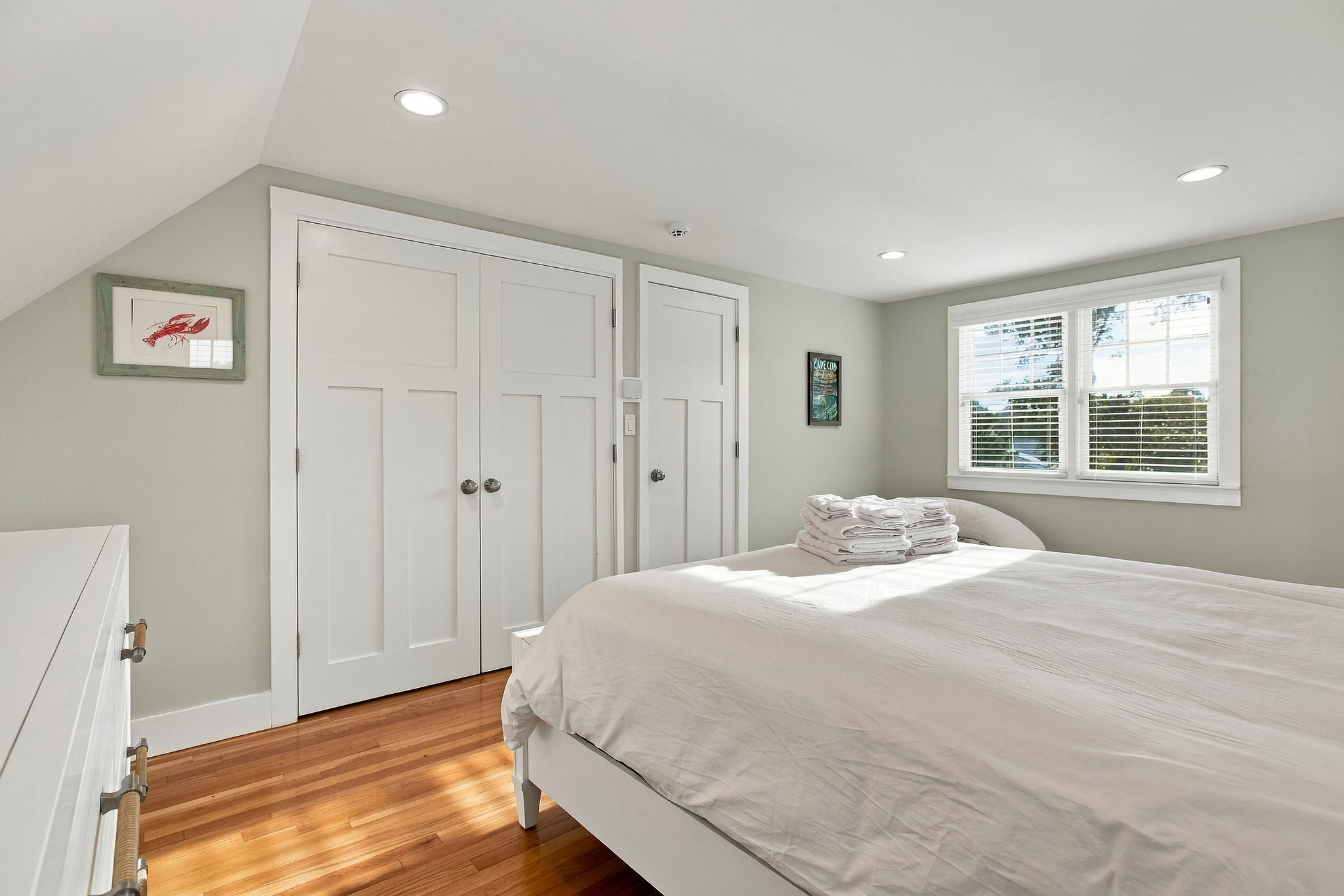 Bright, cozy bedroom with hardwood floors and great natural light