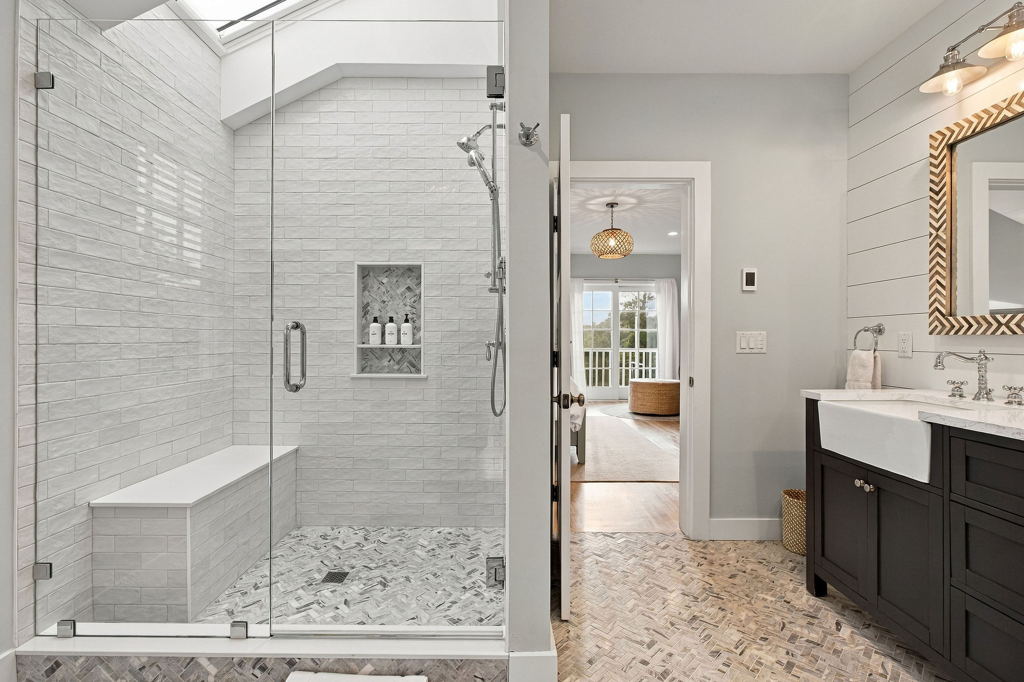 Spa-inspired bathroom with oversized glass shower and stylish double vanity