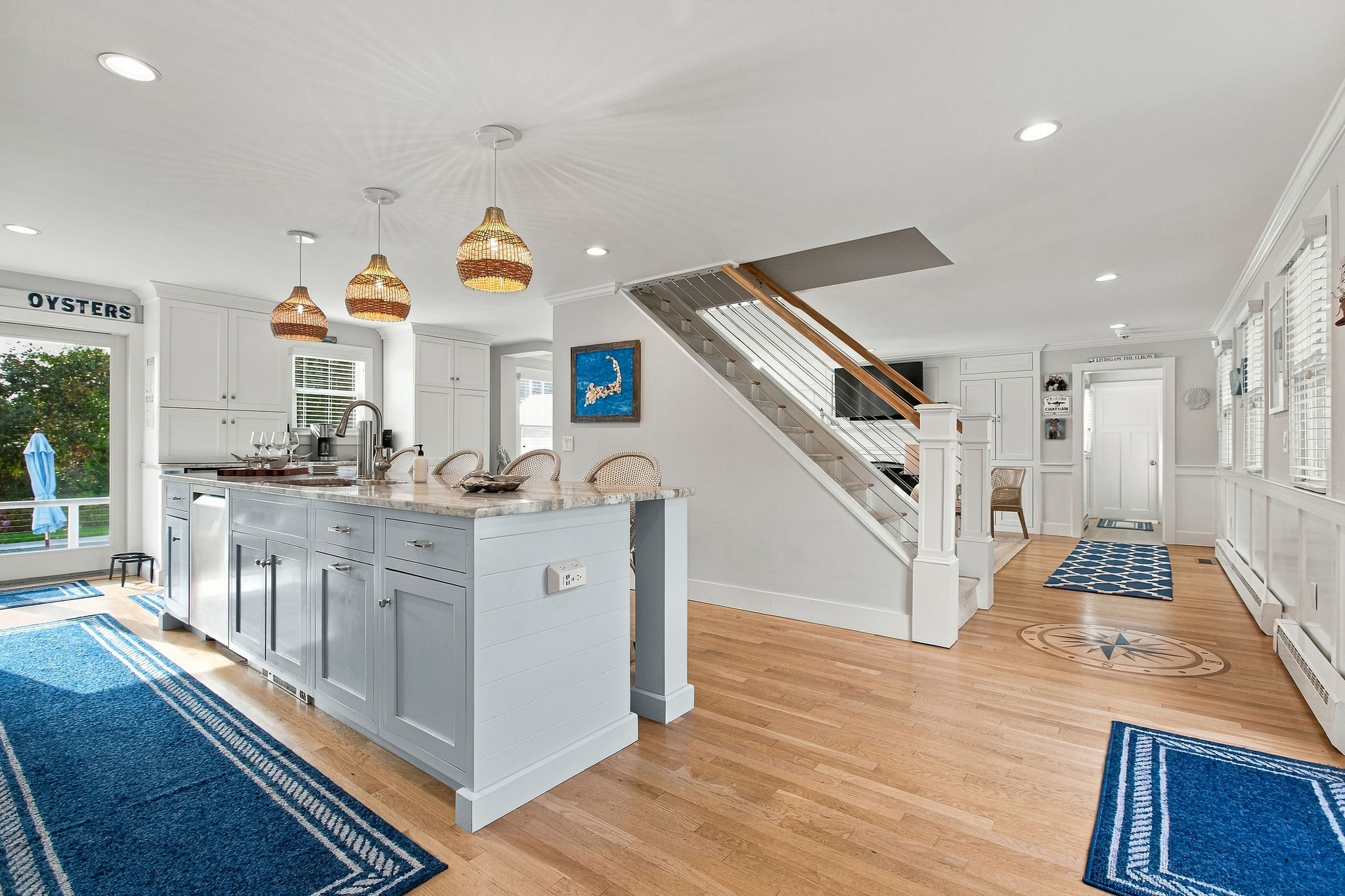 Bright coastal kitchen with spacious island and airy open layout