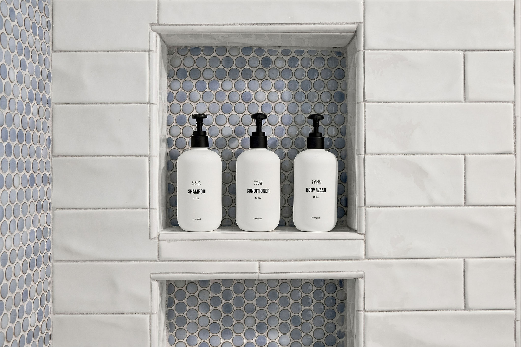 Stylish tiled shower with built-in niche and premium bath amenities