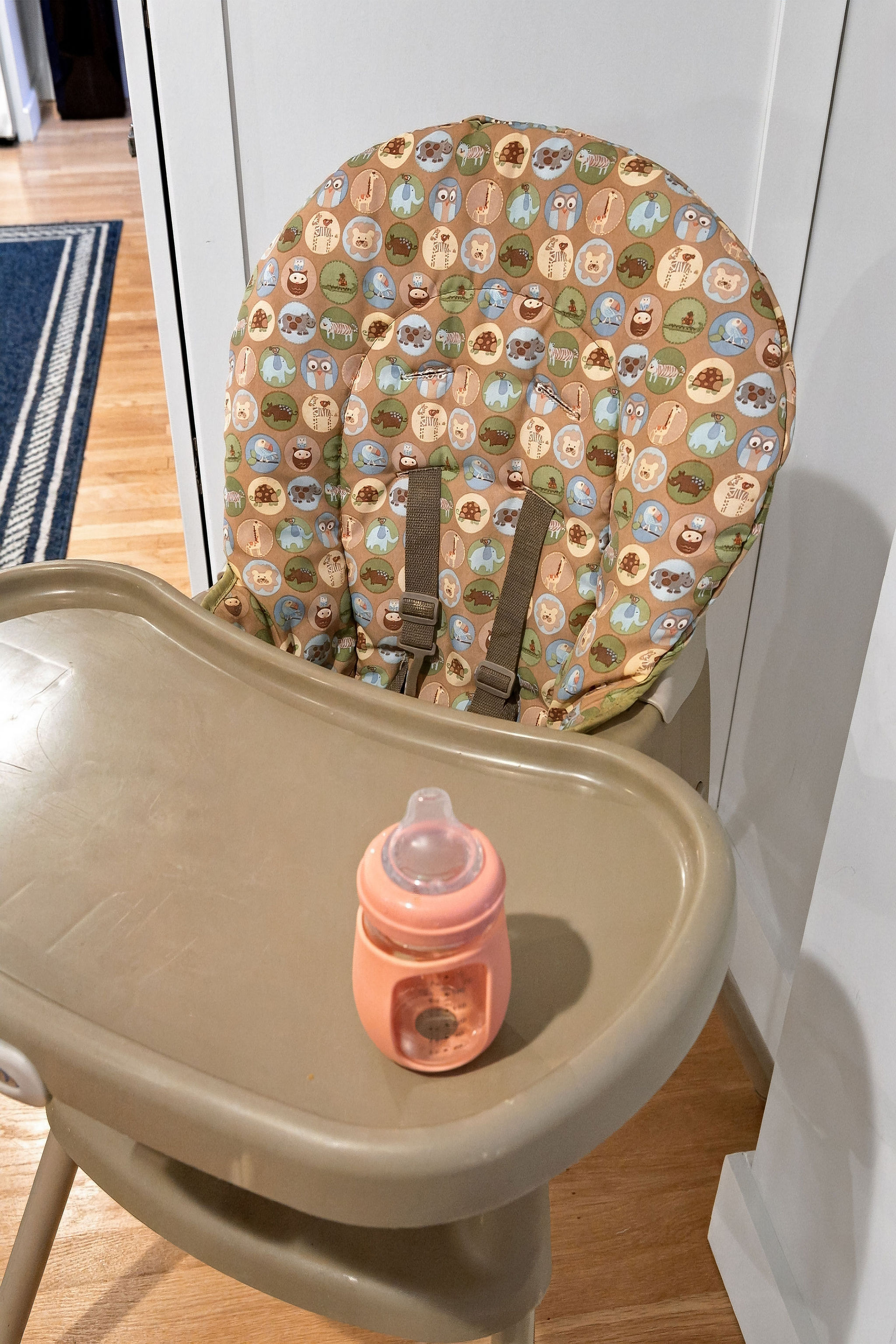 Family-friendly high chair setup with baby bottle for easy mealtimes