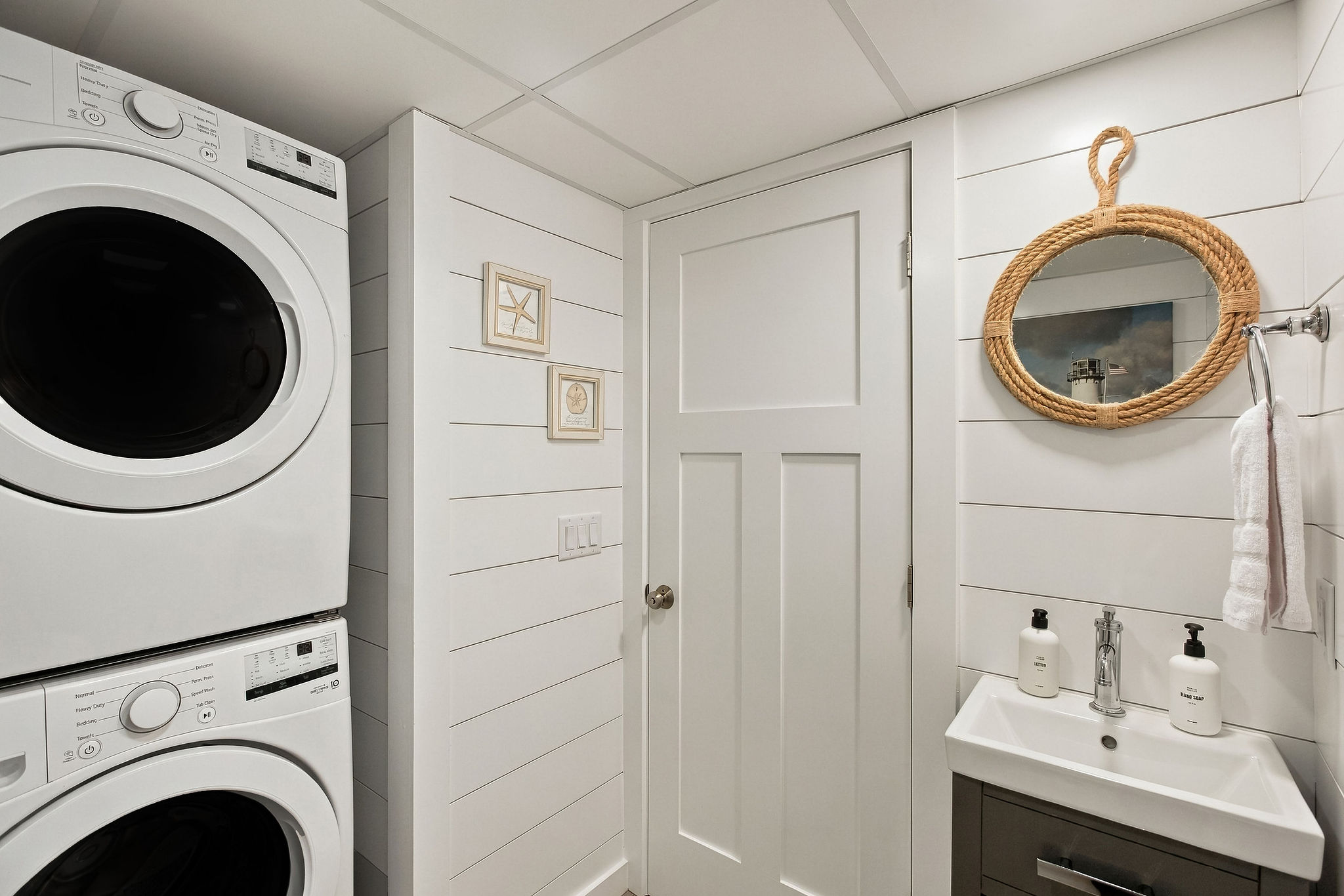 Stylish laundry nook with coastal touches and modern powder room