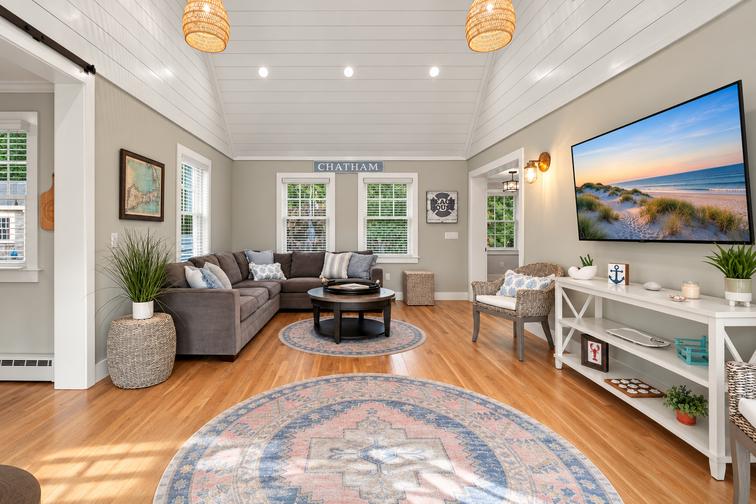 Bright coastal living room with vaulted ceilings and spacious seating