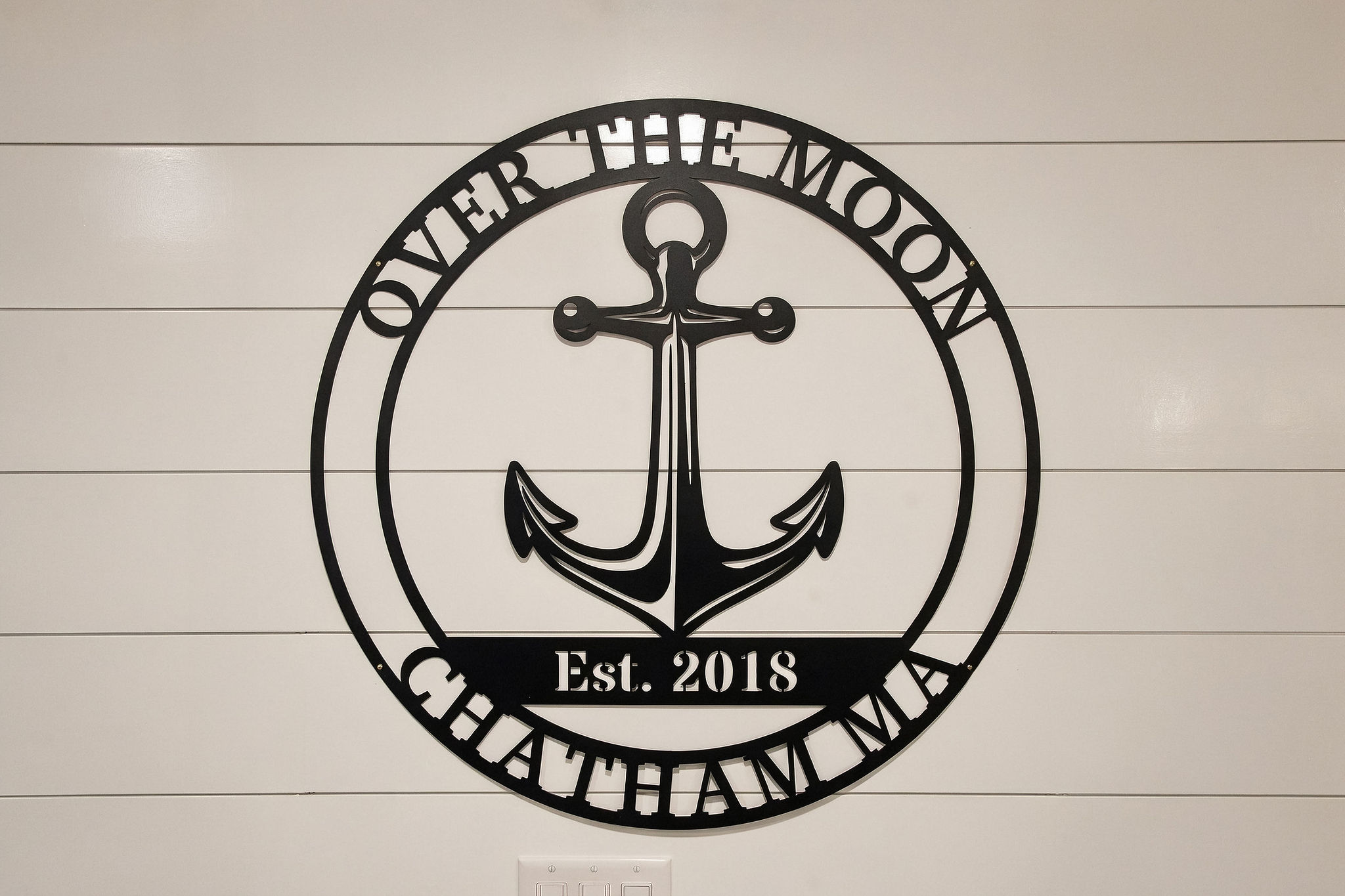 Coastal charm welcomes you with a custom nautical Chatham sign