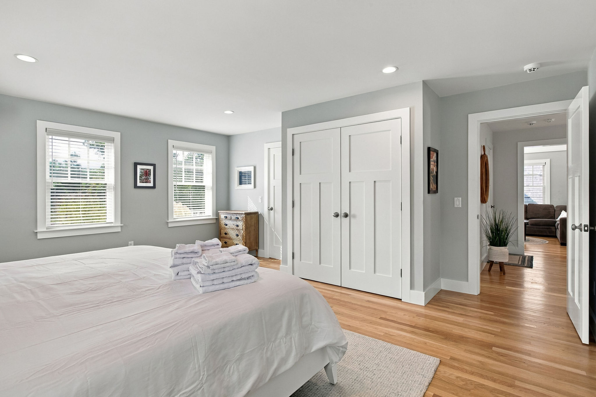 Bright, spacious bedroom with hardwood floors and large closet