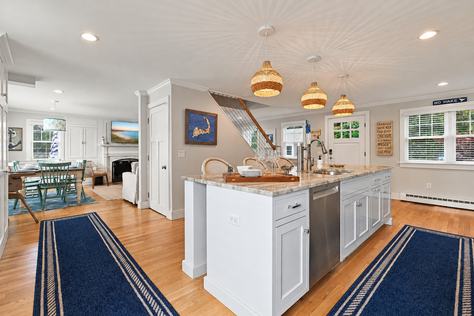 Bright coastal kitchen with large island and open dining space