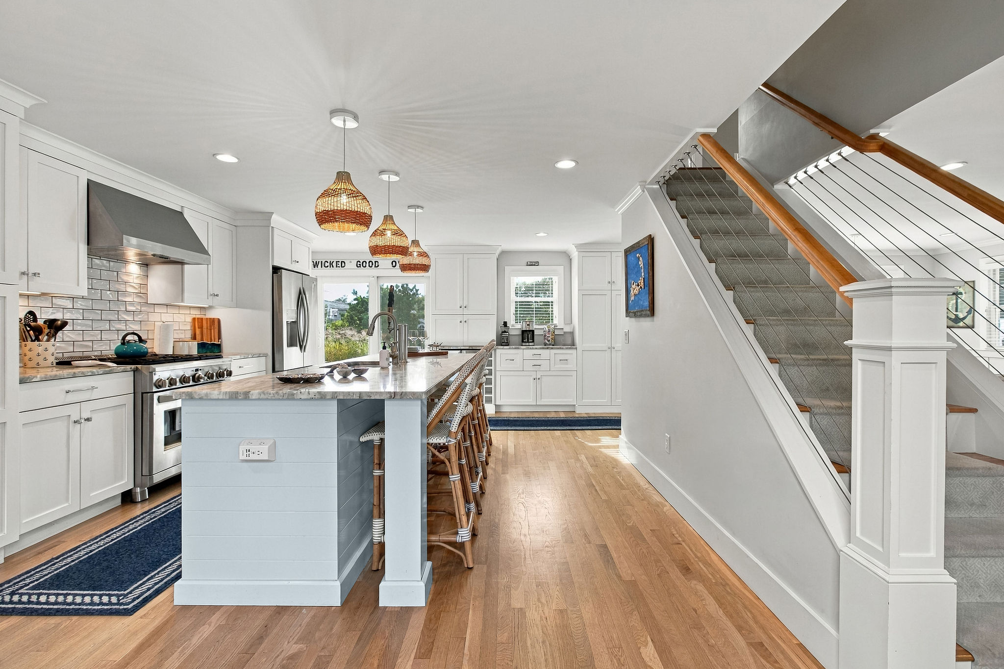 Bright designer kitchen with large island seating and upscale finishes