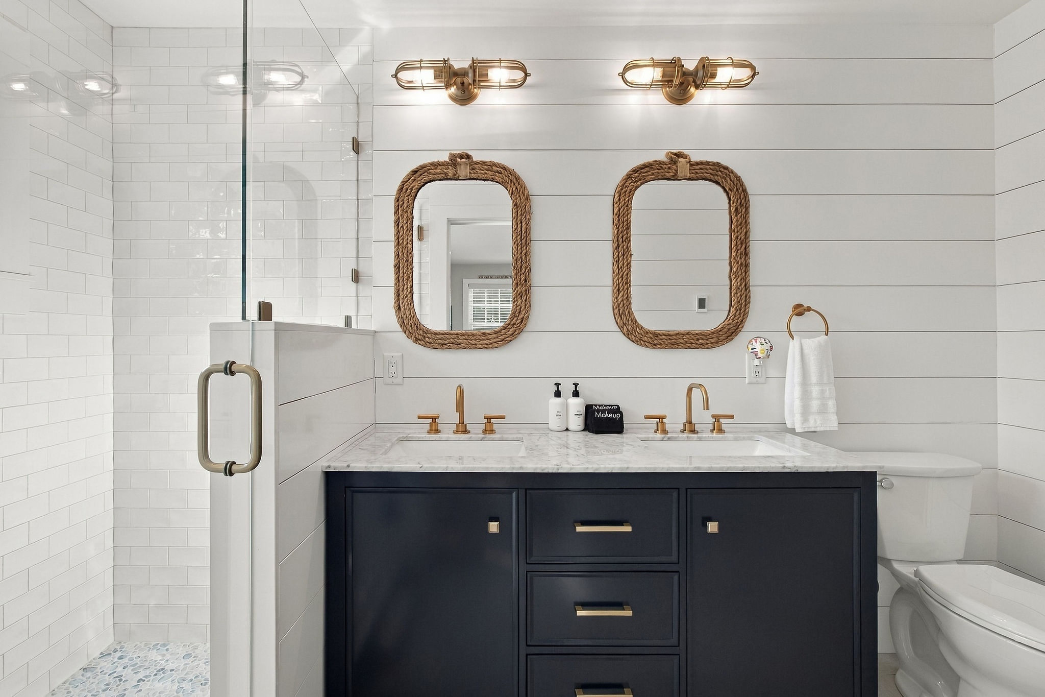 Stylish spa-like bath with double vanity and glass walk-in shower