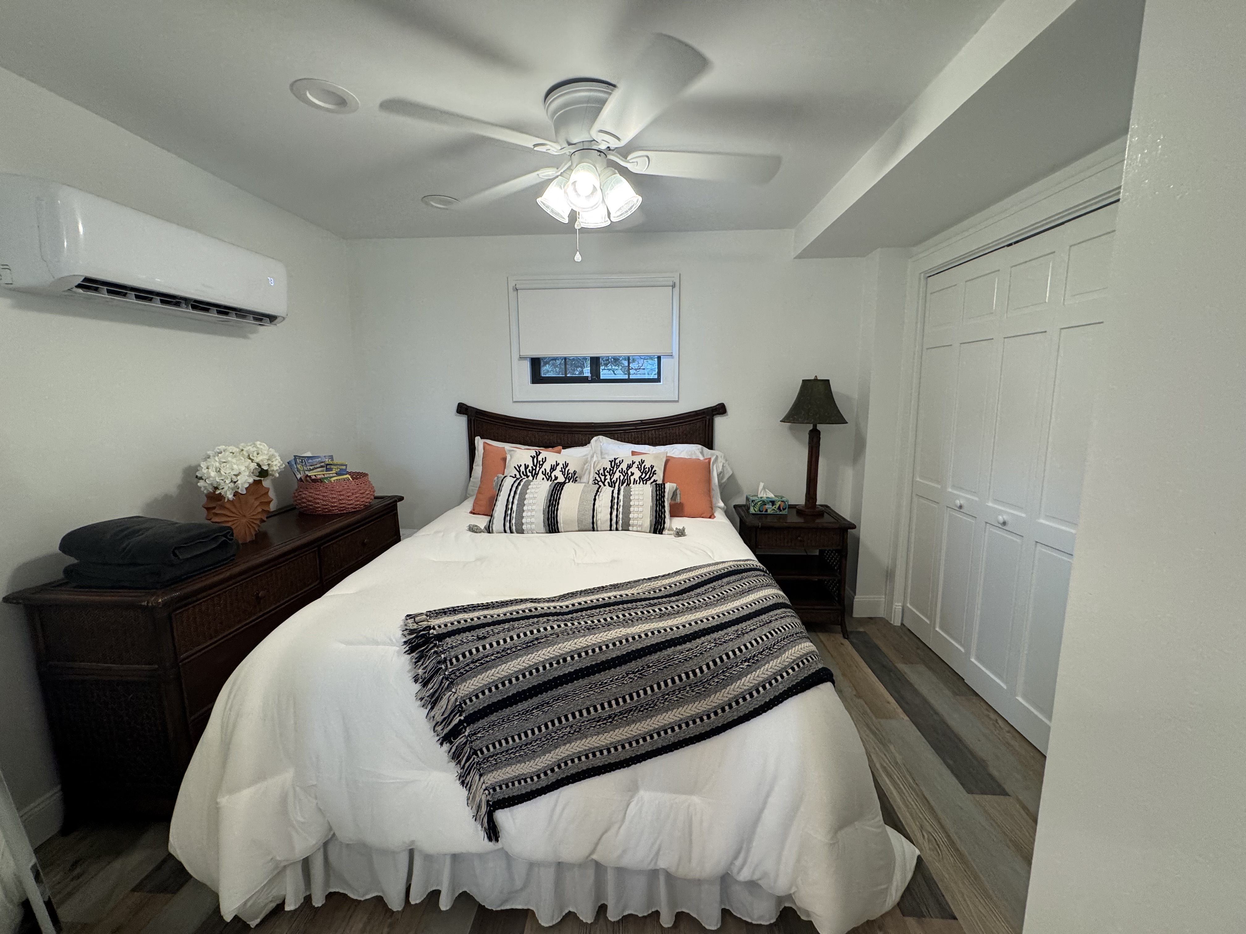 Lower Unit A- Cozy queen bedroom with AC, ceiling fan, and spacious closet