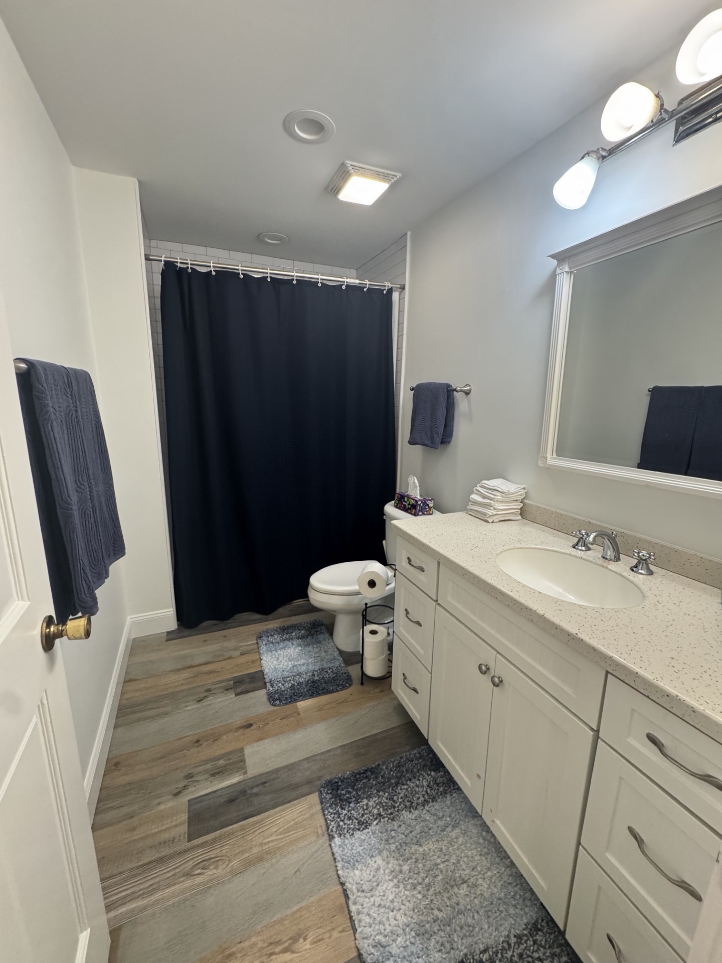 Bright updated bathroom with spacious vanity and modern finishes