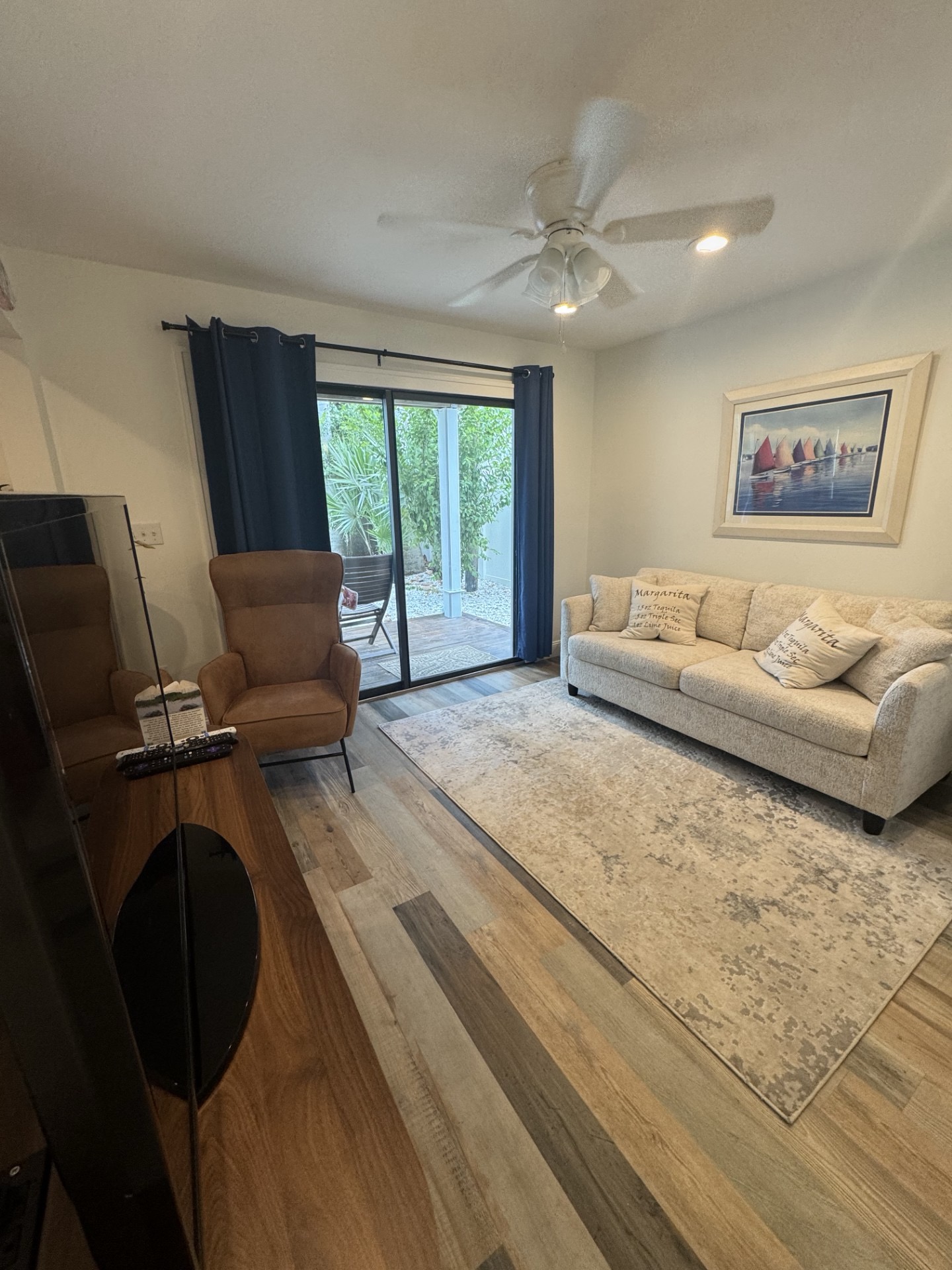 Cozy living room with patio access, natural light, and relaxing seating