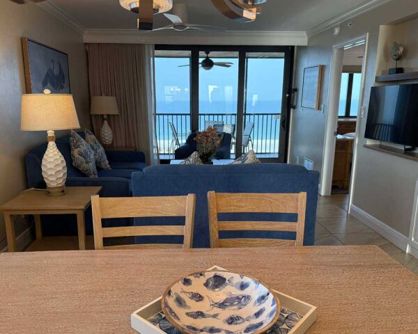 Cozy coastal living room with private balcony and beautiful ocean views