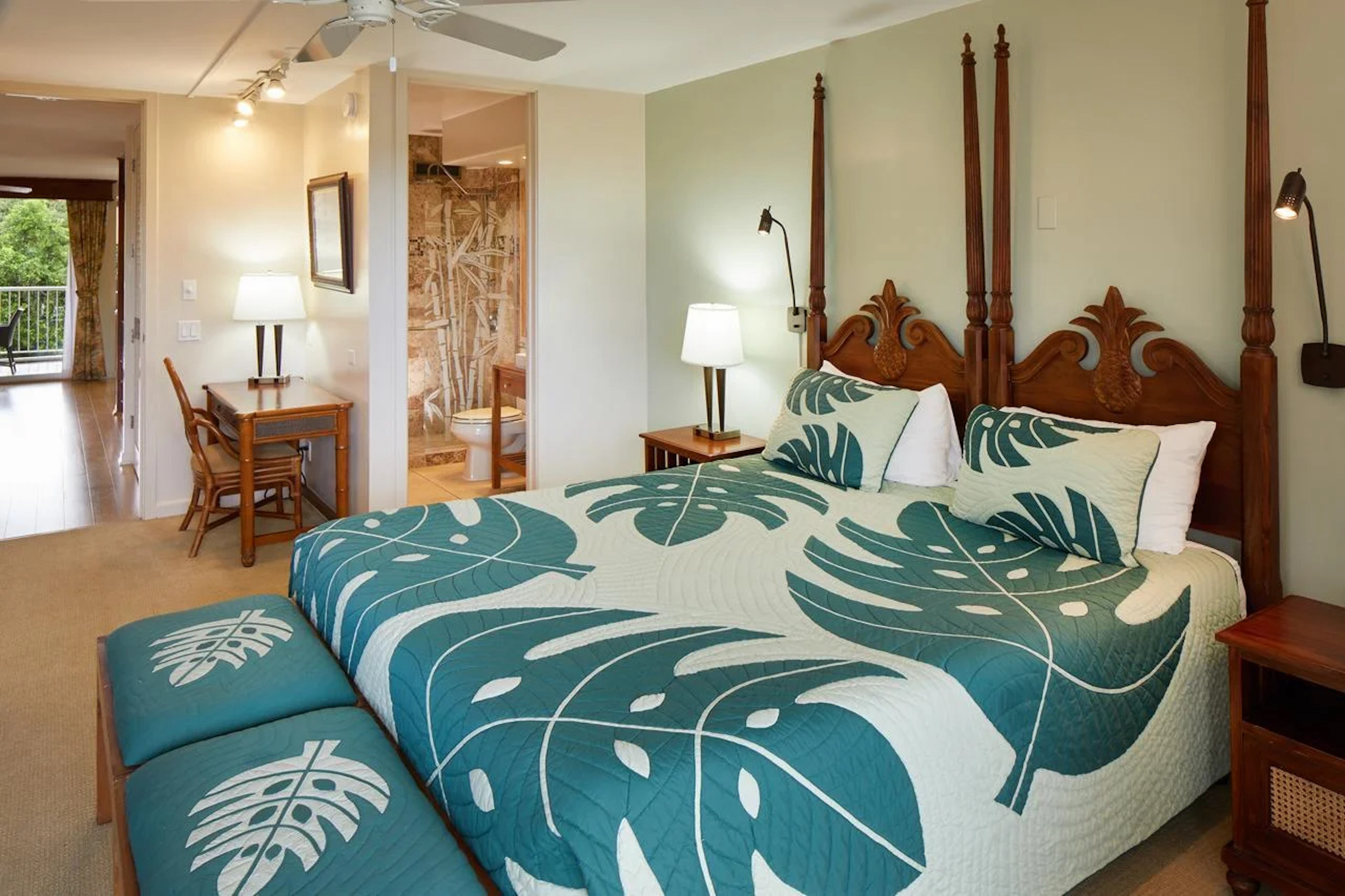 Spacious tropical-style bedroom with four-poster bed and private lanai access