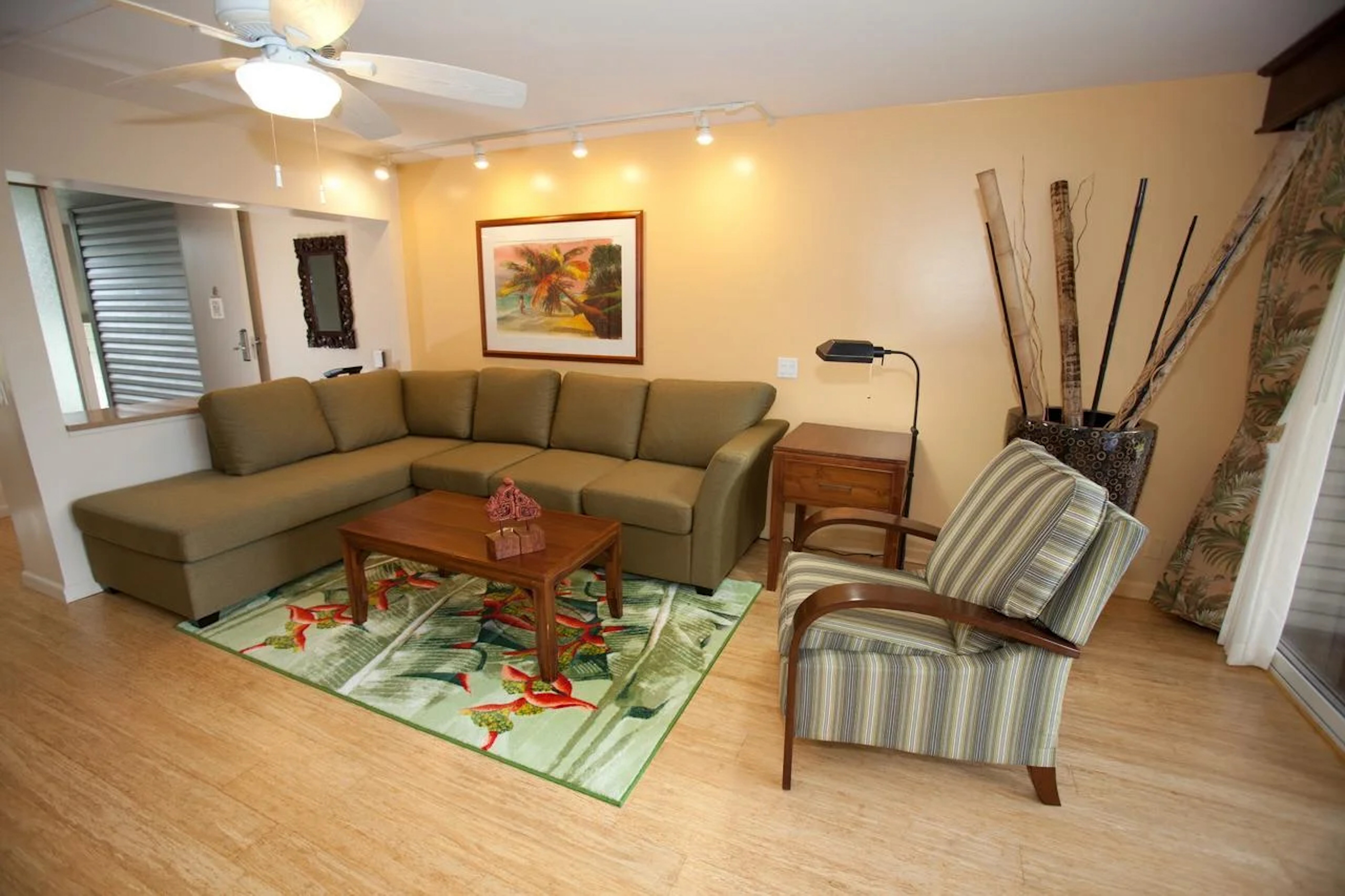 Bright tropical living room with spacious sectional and cozy seating