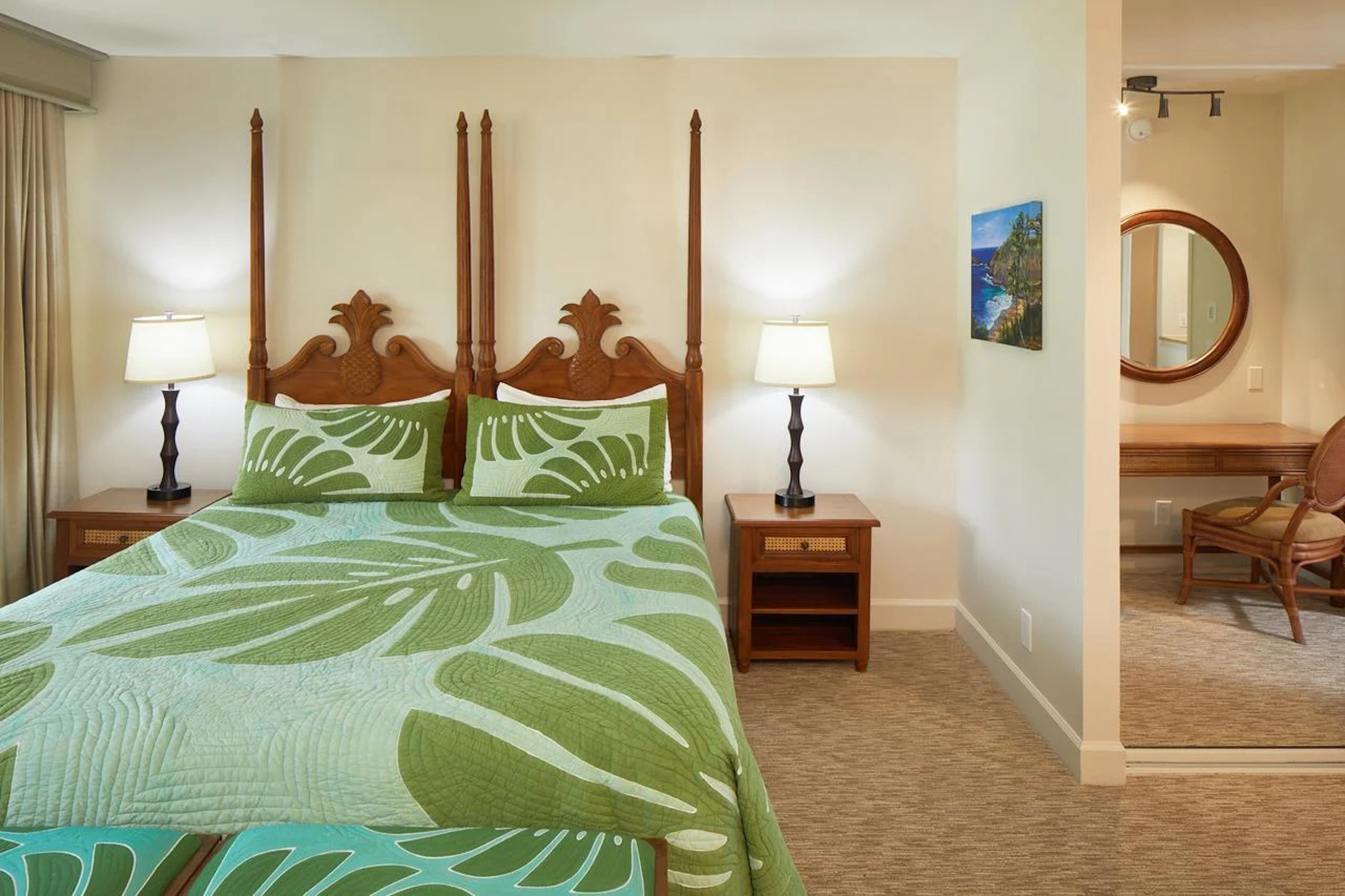 Tropical-style bedroom with four-poster bed and private vanity area