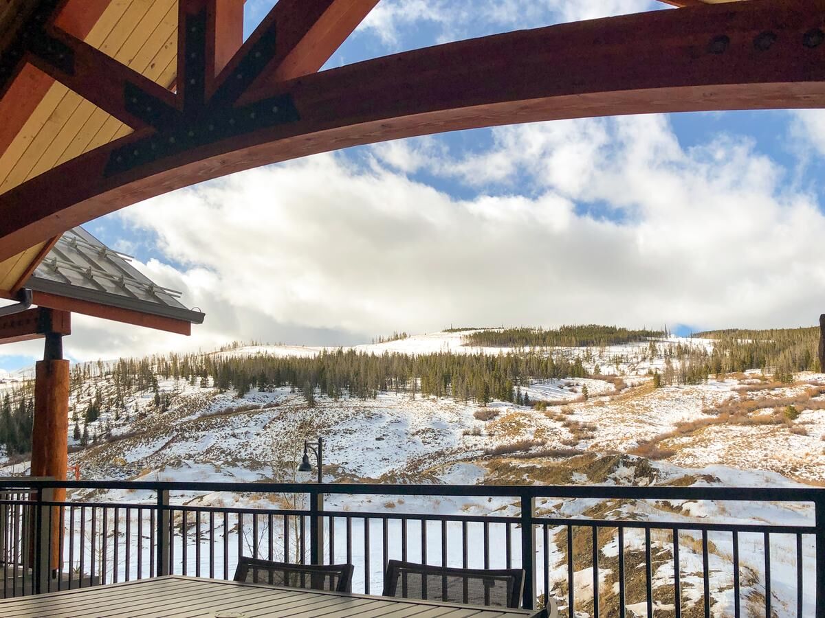 Covered mountain-view deck with stunning snowy alpine scenery