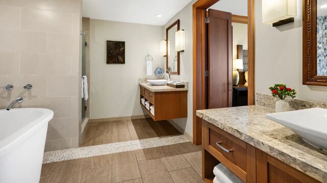 Spa-inspired bathroom with soaking tub, dual vanities, and upscale finishes