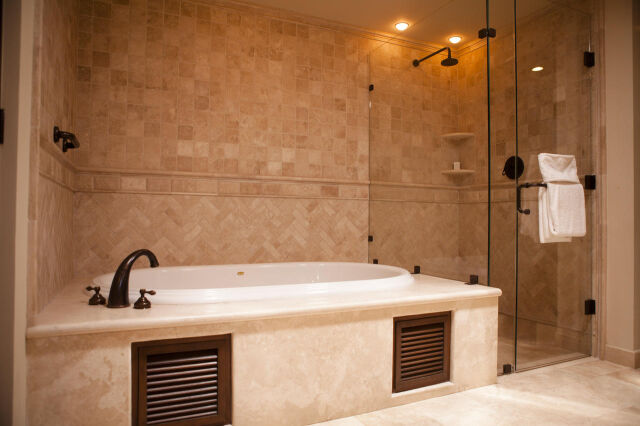 Spa-style bath with soaking tub and spacious glass walk-in shower