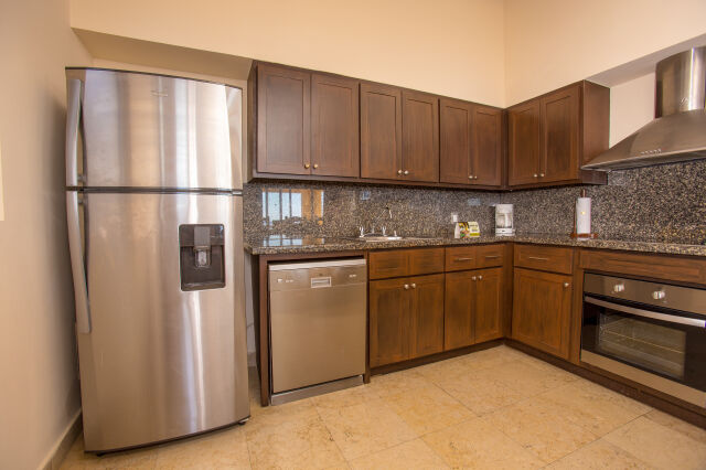 Modern kitchen with granite counters and stainless steel appliances