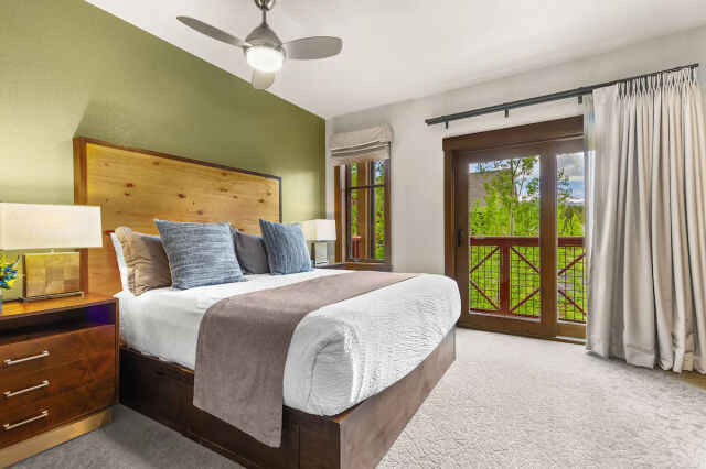 Cozy king bedroom with private balcony and scenic mountain views