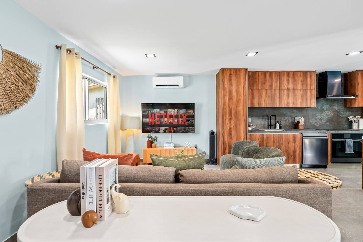 The open layout connects seamlessly to the kitchen, making it easy to relax, gather, and spend time together while cooking or enjoying a meal.