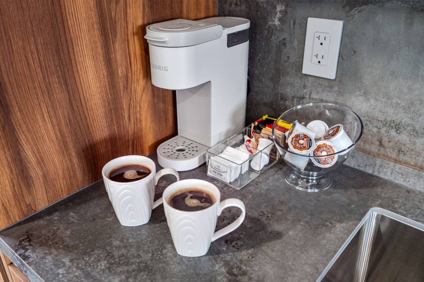 Coffee lovers can enjoy an easy morning routine with the coffee maker ready and waiting in the kitchen.