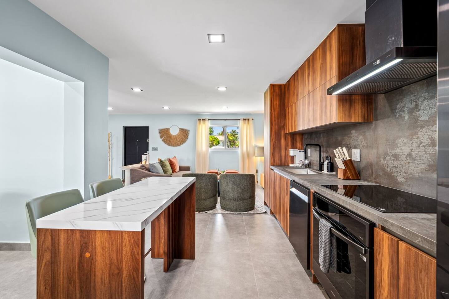Cook and gather with ease in this full kitchen, equipped for everyday meals and family dinners. Its open connection to the living room keeps everyone together while meals are being prepared.