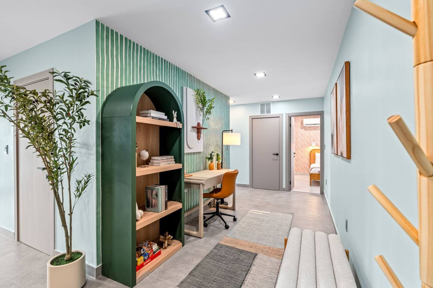 Stay productive with a dedicated workspace featuring a comfortable desk, chair, and lamp, perfect for working remotely or catching up on emails.