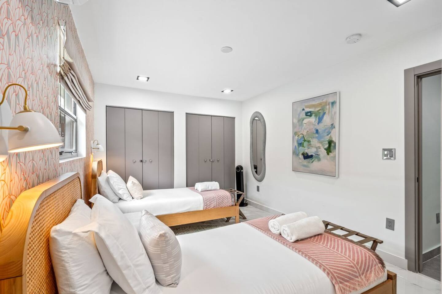 Two single beds provide a cozy place to rest, while the closet offers convenient storage for your stay.