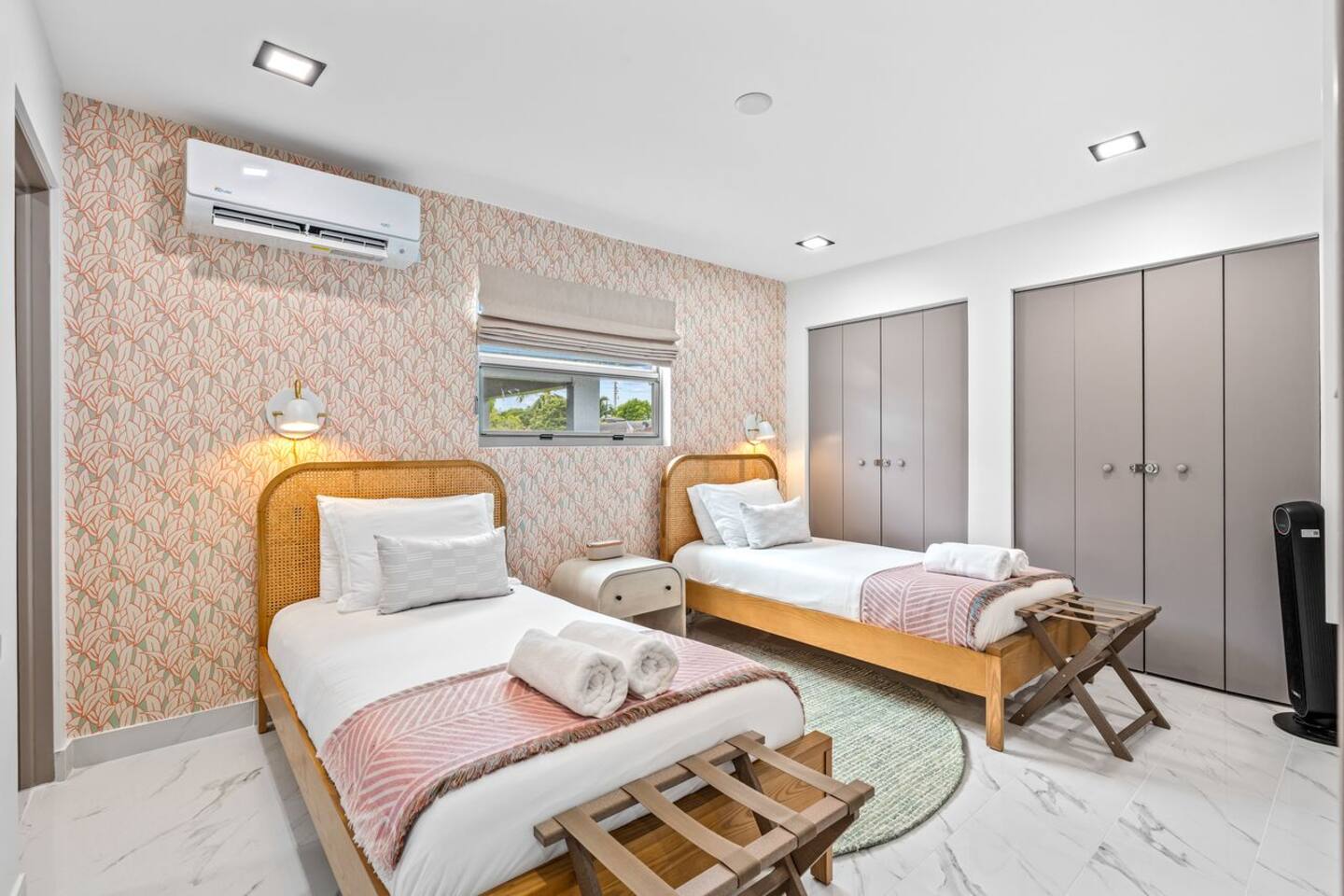 Designed with two single beds, Bedroom 3 gives guests separate sleeping spaces along with a closet for keeping belongings organized.