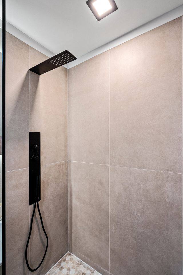 This bathroom is an ensuite to the King bedroom including modern features, a walk-in shower and luxury rain head + hose shower heads for your convenience.