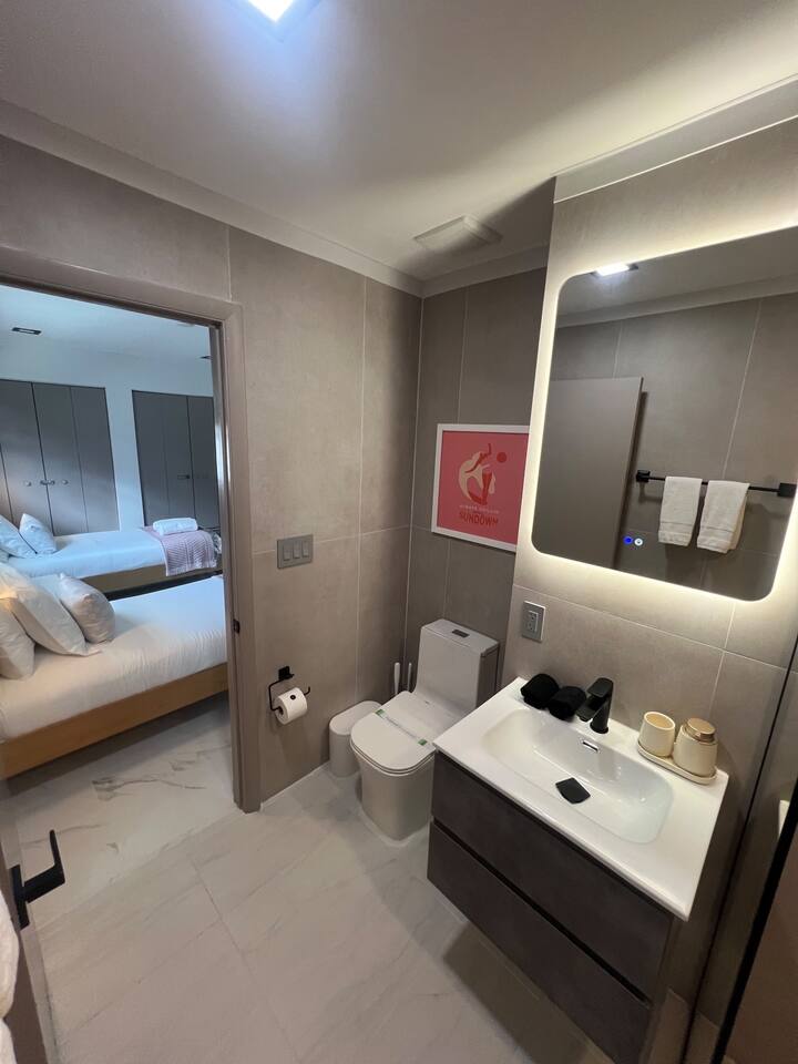 Enjoy the convenience of an ensuite bathroom connected to the 2 single bedroom, a walk-in shower and luxe shower head.
