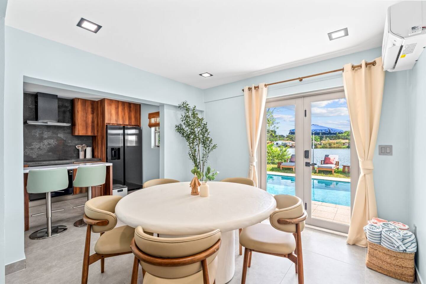 Share a meal, enjoy the view of the pool, and make the most of the connected indoor and outdoor spaces. The dining area offers a comfortable place to gather throughout your stay.