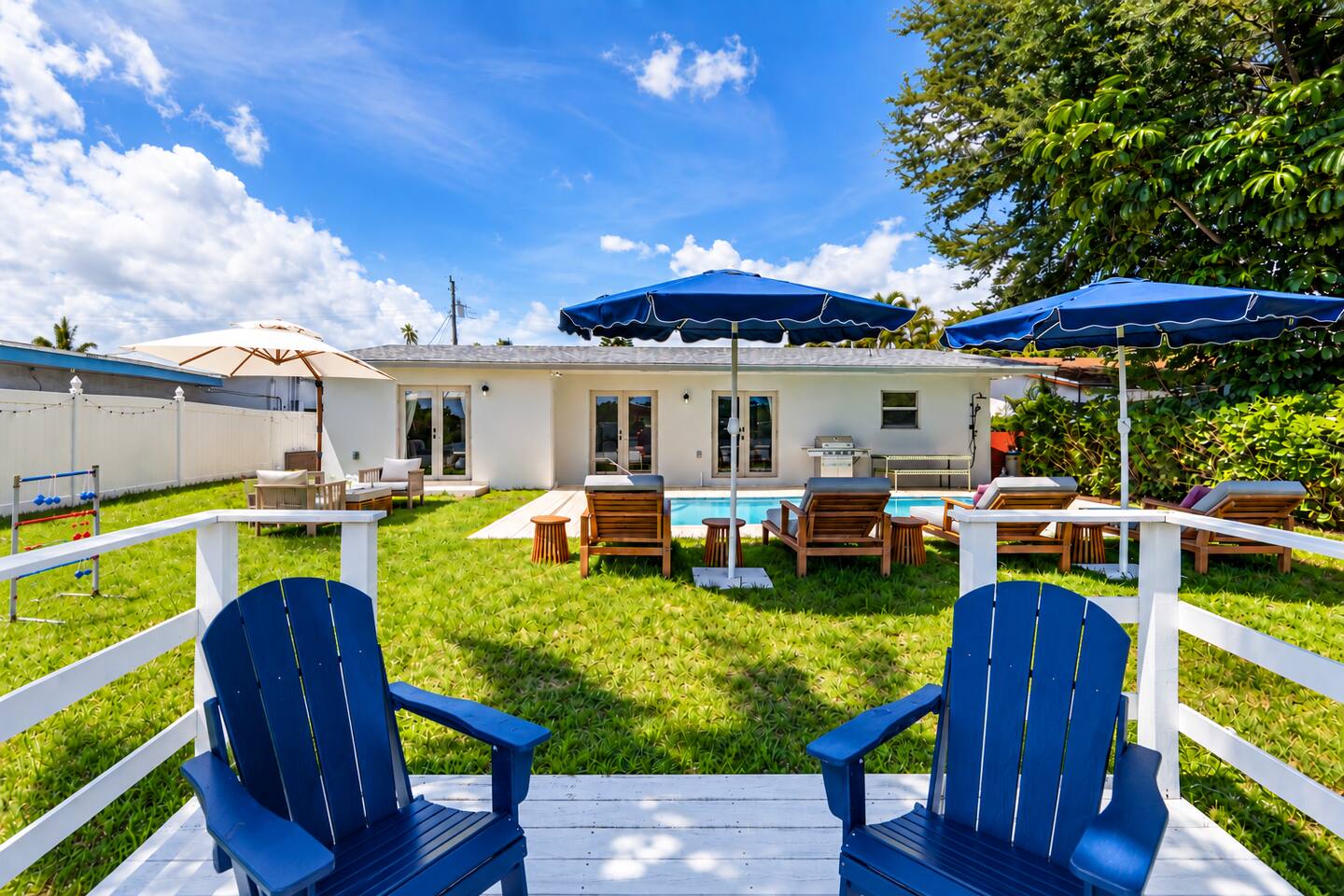 Backyard fun with cornhole, ladder toss, and poolside activities.
