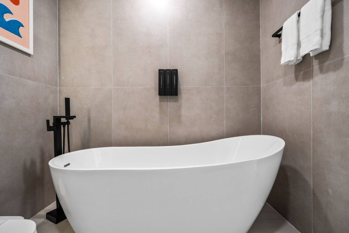 Take some time for yourself with a relaxing soak in the bathtub, perfect for winding down at the end of the day.