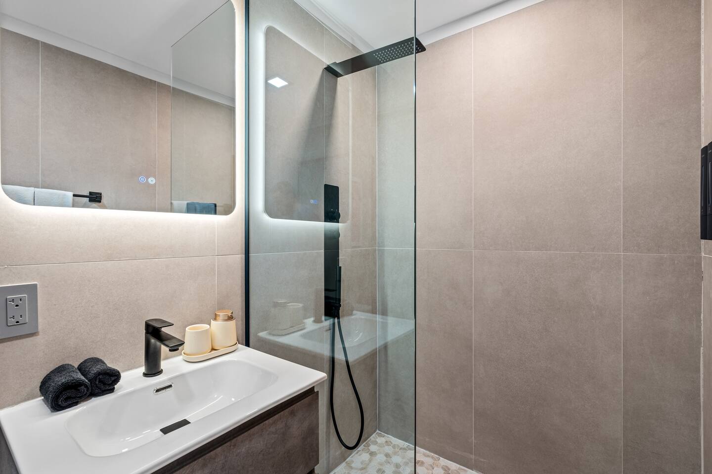 a walk-in shower and luxe shower head.