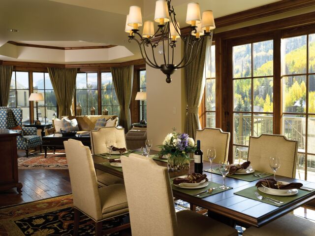 Elegant mountain-view dining and lounge space with sunlit windows