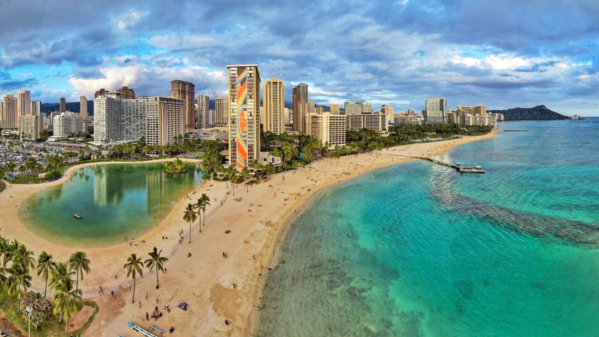 Iconic beachfront views with turquoise water and city skyline