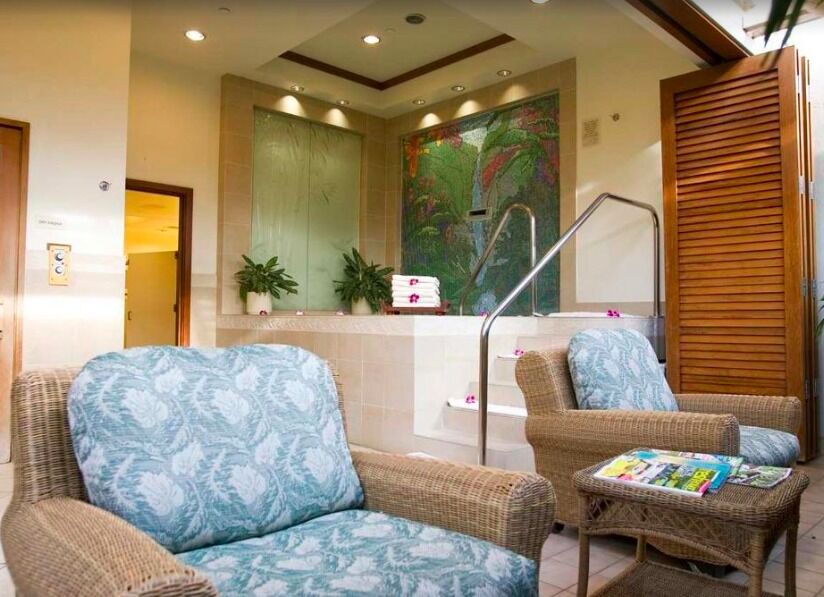 Relax in this tranquil spa lounge with hot tub and tropical resort vibes