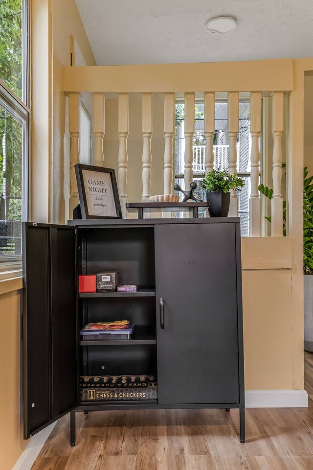 Game cabinet stocked with board games for guests to enjoy during their stay.