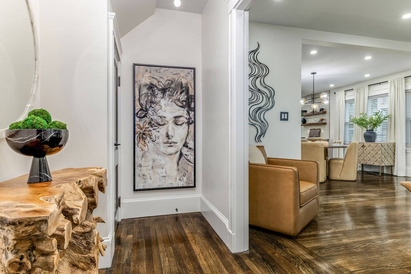Designer entryway leading into the open-concept living and dining areas.