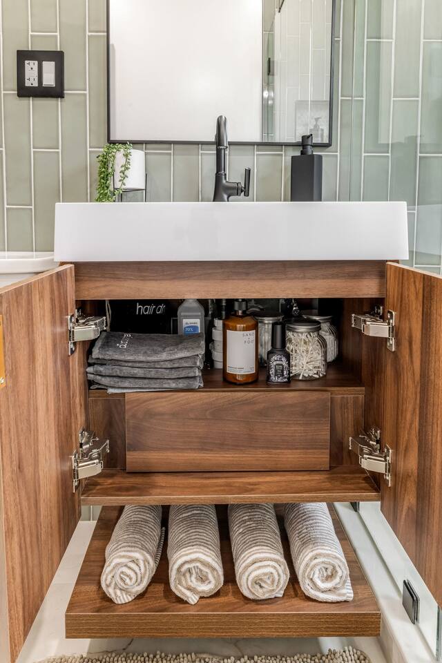 Vanity stocked with essential bathroom amenities for your stay.